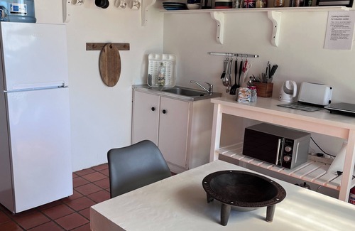 Kommetjie Apartment | Cozy Retreat: 1-Bedroom with stunning sea view down serene green belt."