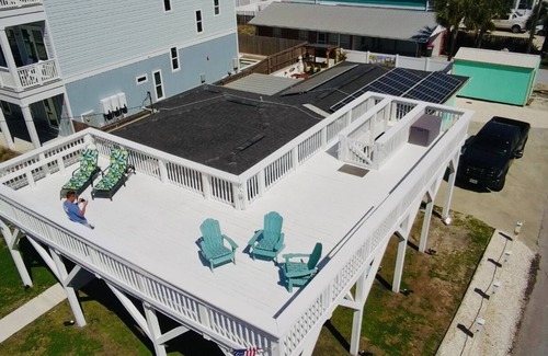 Bel Air House | Cozy Retreat , steps to the beach, heated pool , gulf views & huge party Deck