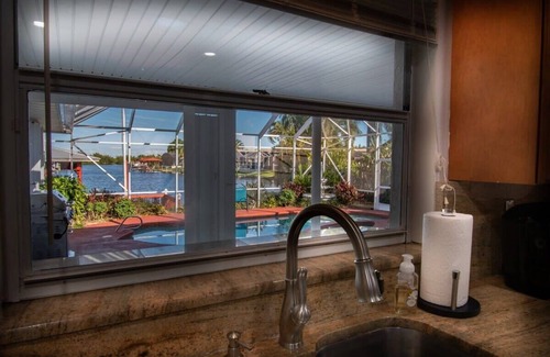 Villa De Palmas House | Cozy Riverfront Home with Pool