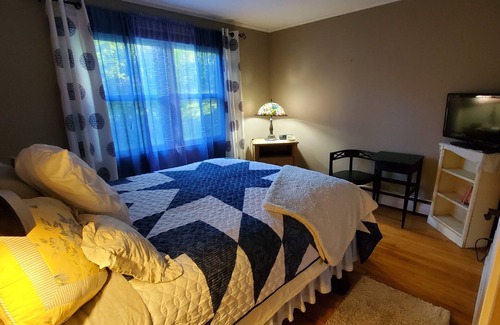 Litchfield House | Cozy room inside a country cottage style home, with a shared bathroom