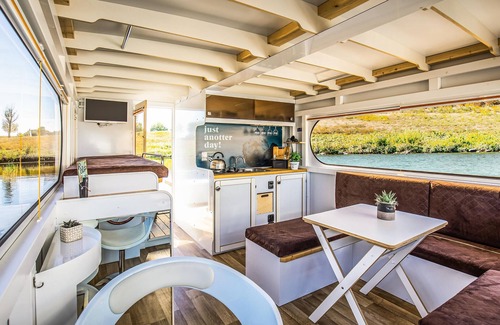 Ophoven Boat Rental | Cozy ship in Ophoven with harbor view