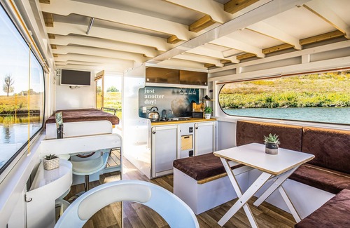 Ophoven Boat Rental | Cozy ship in Ophoven with lake view