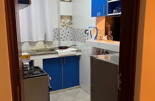 Mombasa Apartment | Cozy specious living room with a Tv for entertainment and free WiFi.