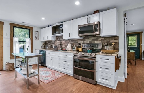 Skyland Cottage | Cozy stone Cottage Pet friendly on Rushing creek porch, soaking tub, & fire-pit