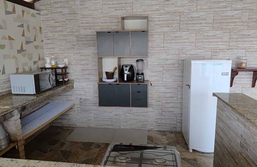 Barra Nova Villa | Cozy suite with a view of the space, air conditioning, minibar and smart TV