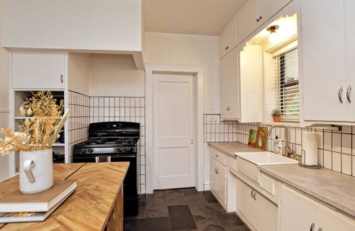 Austin Ave. House | Cozy Tudor Bungalow in Waco