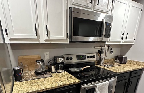 Simpsonville Condo | Cozy two bedroom with patio and indoor fireplace