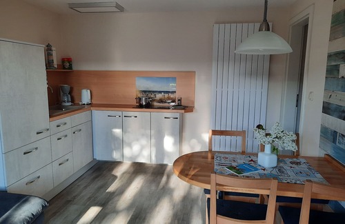 Ostseebad Kuhlungsborn Apartment | Cozy vacation apartment with natural stone terrace surrounded by greenery