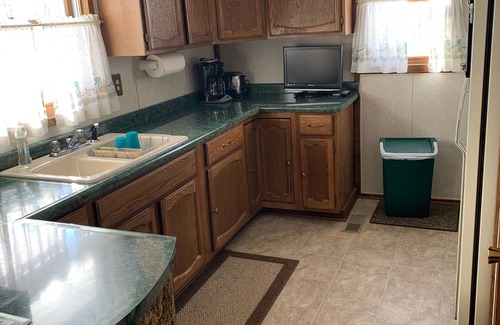 Lakewood House | Cozy vacation home nestled in a quiet wooded area. Near town but private