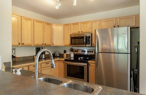 Wildernest Condo | Cozy Watch Hill Lodge: Stunning Mountain Views, Shared Hot Tub, and Convenient Ski Resort Access!