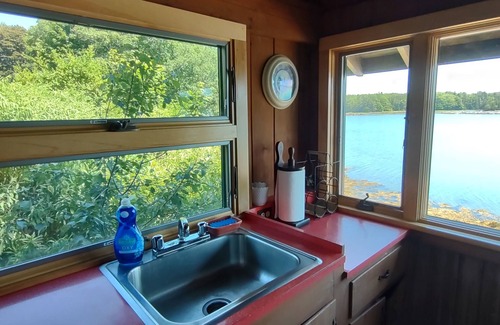 South Bristol Cabin | Cozy waterfront log cottage with huge outdoor living area.