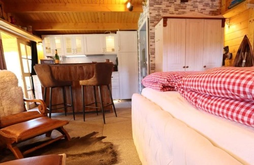 Neufeld House | Cozy wooden cottage quietly situated behind the dike with terrace