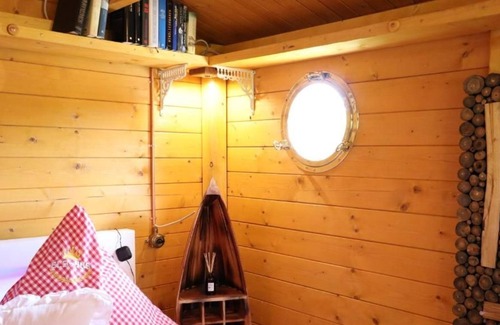 Neufeld House | Cozy wooden cottage quietly situated behind the dike with terrace