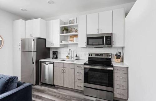 Cole-Noble District Apartment | CozySuites at East Washington