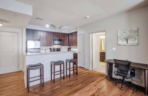 Central Business District Apartment | CozySuites at the Banks gym, pool 16