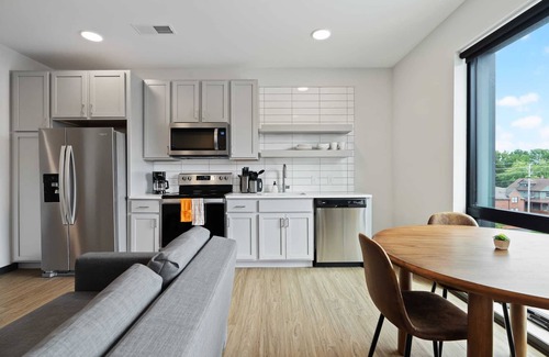 Lockerbie Square Apartment | CozySuites Mass with parking, lounge and roof deck 7