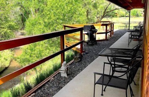 Cody Apartment | Creek Side Cabin #1 in the Wapiti Valley and steps from Trout Creek