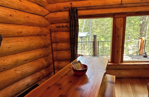 Crawford Bay Cabin | Creek side cabin in the woods with wood stove and deck - pet friendly!