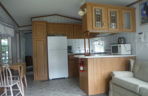 Curtis House | Darling Park Model Trailer downtown Curtis with views of South Manistique Lake