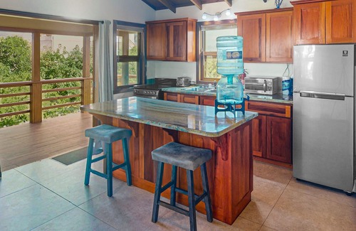Caye Caulker Cottage | Dazzling beach stay with a balcony - pool, bikes, canoes, grill, & dock access