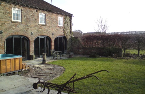 Buckton Cottage | Deceptively spacious and cosy cottage with enclosed gardens and hot tub.