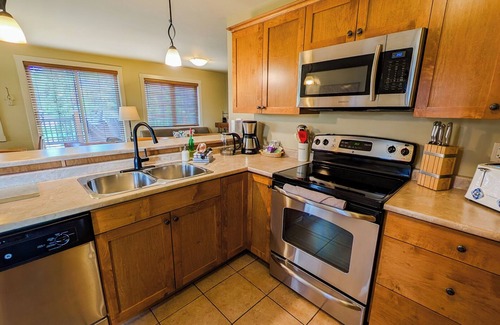 Golden Condo | Deckview: 2-bedroom top floor condo with hot tub and mountain views