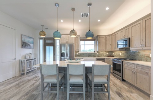 Sanibel House | DEJA BLUE | Lux Canal-Front Sanibel Home with Saltwater Pool and View