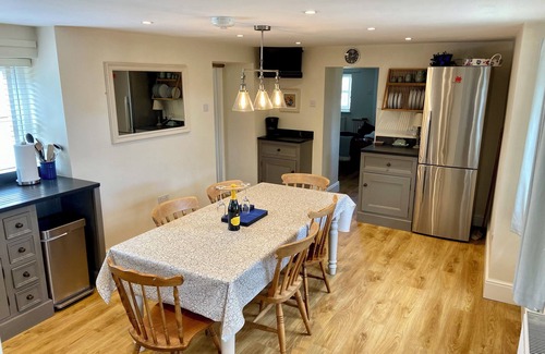 Mynytho Cottage | Delightful 3 bed cottage with hot tub, wood burning stove and sea views