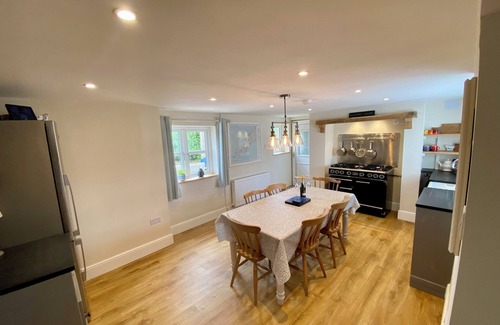 Mynytho Cottage | Delightful 3 bed cottage with hot tub, wood burning stove and sea views