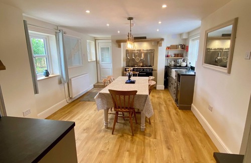 Mynytho Cottage | Delightful 3 bed cottage with hot tub, wood burning stove and sea views