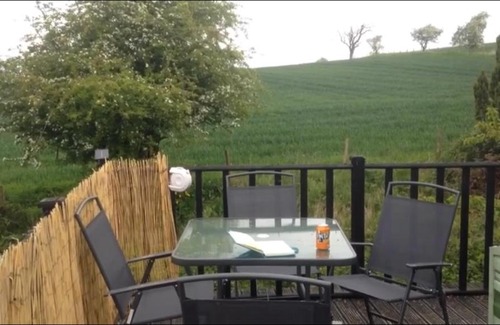 Fence Other | Delightful 3 bedroom holiday home with balcony overlooking fields and a stream