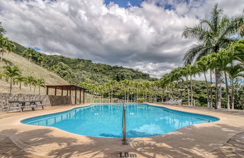 Santa Eulalia House | Delightful cabin in Atenas with terrace, garden view, and shared pool!