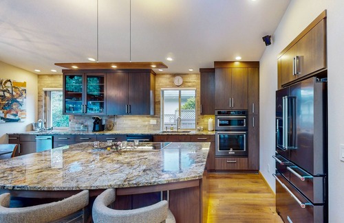 Blue Heron House | Delightful Retreat with Water Views, Fast WiFi, Gas Grill, & Furnished Patio