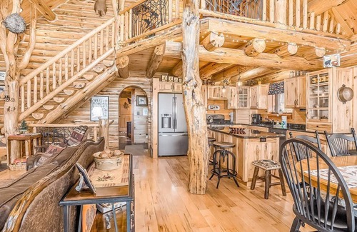 Thompsonville Cabin | Delightful Riverfront Cabin with Wood-Burning Fireplace and Gas Grill & Hot Tub