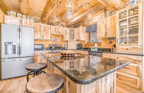 Thompsonville Cabin | Delightful Riverfront Cabin with Wood-Burning Fireplace and Gas Grill & Hot Tub