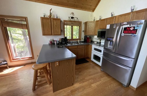 Leland Ski Chalet | Dells area pet-friendly lake house w/HOT TUB! (and boat avail.)