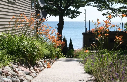Au Gres House | Deluxe 5 bedroom Lakefront home, Lake Huron, Sandy Beach, Wooded Point