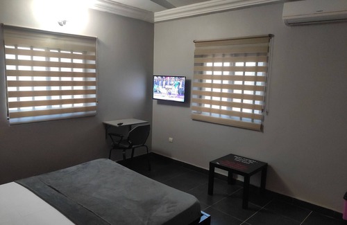 Lome House | Deluxe Double Bed in Royal Blue Guest House and Bar 02