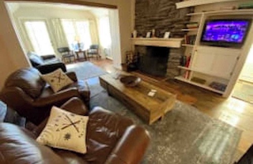 West Dover Resort | Deluxe King Suite, Living Room area w/sofa bed & fireplace, private entrance