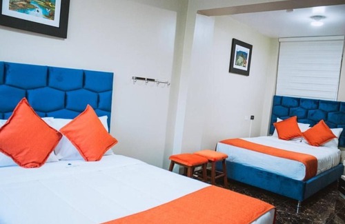 Santiago de Surco Apartment | Deluxe Queen Room with Two Queen Beds 4