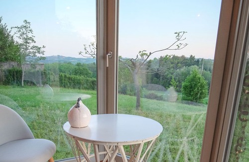 San Maurizio House | Dependance Rose, a romantic living room with double bed and bathroom