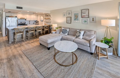 Vanderbilt Beach Condo | Designer Condo! Walk to the Beach! Bay Views! Rooftop Pool! Fully Renovated!