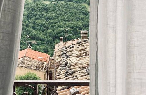 Caramanico Terme House | Designer home with artistic soul, a panoramic garden overlooking the mountains.