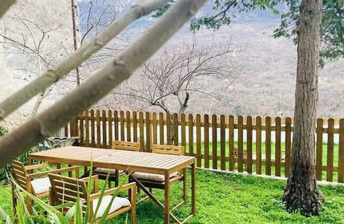 Caramanico Terme House | Designer home with artistic soul, a panoramic garden overlooking the mountains.