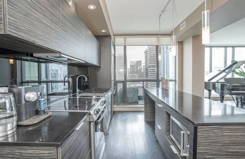 Fashion District Apartment | Designer Penthouse with Grand Piano & Lake Views