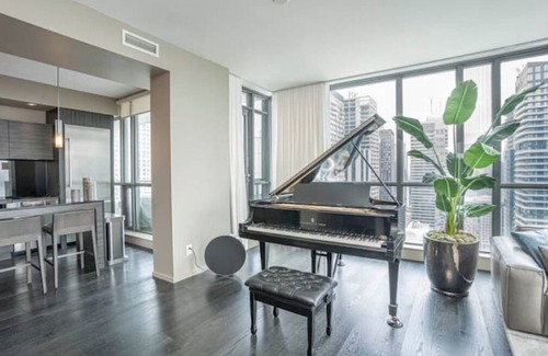 Fashion District Apartment | Designer Penthouse with Grand Piano & Lake Views