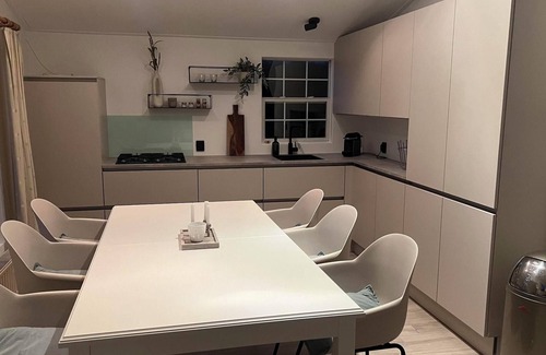 Groede House | Detached 6-person waterfront chalet in Groede. Enjoy peace, nature, spacious garden, modern kitchen and proximity to beach and village.
