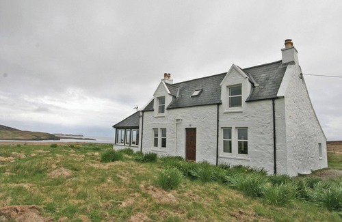 Kilmaluag Cottage | Detached croft cottage in an elevated position above Aird Bay in the spectacular north of Skye.