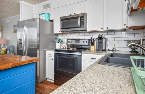 Ash Condo | Direct beach access! Beachfront Bliss with Pool & Modern Comforts!