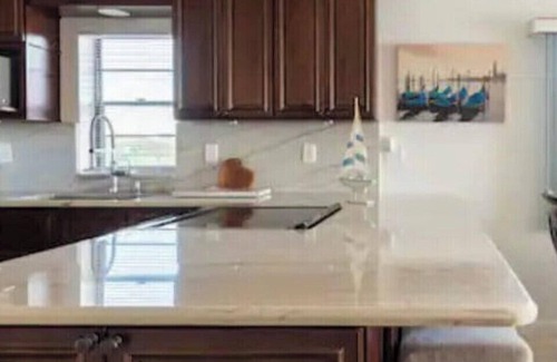 Port Canaveral Condo | Direct River gorgeous view! Newly remodeled, quartzite counter open floor plan
